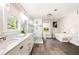 Luxurious bathroom with a freestanding tub, glass-enclosed shower, and double vanity at 517 Daniel Ave, Decatur, GA 30032