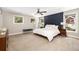 Spacious bedroom with neutral carpet, recessed lighting, and a statement accent wall at 517 Daniel Ave, Decatur, GA 30032