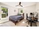 Bedroom with a wooden bed frame, neutral carpet, and a desk area for working from home at 517 Daniel Ave, Decatur, GA 30032