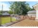 Backyard deck with steel cable railing overlooking the backyard and small outbuilding at 517 Daniel Ave, Decatur, GA 30032