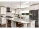 Modern kitchen with granite counters, a stylish tile backsplash, stainless appliances, and a breakfast bar at 517 Daniel Ave, Decatur, GA 30032