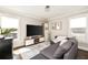 Comfortable den with modern entertainment center, lots of natural light, and modern decor at 517 Daniel Ave, Decatur, GA 30032