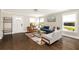 Bright living room featuring modern furnishings, hardwood floors, fresh paint, and abundant natural light at 517 Daniel Ave, Decatur, GA 30032