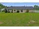 Expansive backyard featuring a lush lawn and mature trees, perfect for outdoor enjoyment at 12 Bonnie Glen Ln, Hampton, GA 30228