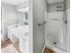 The bathroom features double sinks, a shower stall, and updated lighting fixtures at 12 Bonnie Glen Ln, Hampton, GA 30228