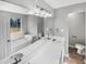 Bright bathroom features double sinks, a soaking tub, and modern fixtures at 12 Bonnie Glen Ln, Hampton, GA 30228