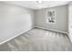 This bedroom features plush carpeting and a window letting in plenty of natural light at 12 Bonnie Glen Ln, Hampton, GA 30228