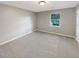 Neutral bedroom with a window providing natural light and plush carpeting at 12 Bonnie Glen Ln, Hampton, GA 30228