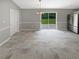 Dining room featuring a sliding glass door, stainless steel refrigerator and decorative lighting at 12 Bonnie Glen Ln, Hampton, GA 30228