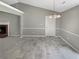 Open dining area featuring tile floors, neutral paint, and decorative chandelier at 12 Bonnie Glen Ln, Hampton, GA 30228