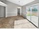 Open dining area with sliding glass doors leading to the backyard patio at 12 Bonnie Glen Ln, Hampton, GA 30228