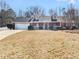 Charming brick home with a dormer window and a two-car attached garage at 12 Bonnie Glen Ln, Hampton, GA 30228