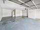This is an open garage with concrete flooring and walls at 12 Bonnie Glen Ln, Hampton, GA 30228
