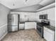 Updated kitchen with stainless steel appliances, granite countertops, and ample cabinet space at 12 Bonnie Glen Ln, Hampton, GA 30228