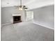 Spacious living room featuring plush carpet and fireplace, great for entertaining guests at 12 Bonnie Glen Ln, Hampton, GA 30228