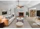 Bright living room with a fireplace, vaulted ceiling, and stylish furnishings, virtually staged at 12 Bonnie Glen Ln, Hampton, GA 30228