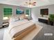 Inviting main bedroom with a large bed, soft lighting, and scenic wall art at 12 Bonnie Glen Ln, Hampton, GA 30228