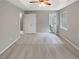 Spacious primary bedroom with plush carpeting, tray ceiling, and ensuite bathroom access at 12 Bonnie Glen Ln, Hampton, GA 30228