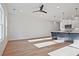 Bright kitchen featuring recessed lighting, white cabinets, a dark island, and light hardwood floors at 213 Admor Ln, Acworth, GA 30102