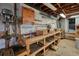 Basement with workbench, shelving, sink, and wood cabinetry, offering workspace at 4149 Lynette Ne Ct, Kennesaw, GA 30144