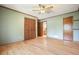 Bedroom featuring hardwood floors, a ceiling fan, and ensuite bathroom entrance at 4149 Lynette Ne Ct, Kennesaw, GA 30144