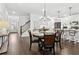 Open-concept dining area with hardwood floors flowing to a gourmet kitchen with stainless appliances and white cabinetry at 871 Dunning St, Marietta, GA 30060