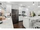 Bright white kitchen featuring stainless steel appliances, marble countertops, and barstool seating at 871 Dunning St, Marietta, GA 30060
