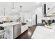 Bright kitchen featuring stainless steel appliances, marble countertops, barstool seating and a stainless steel farmhouse sink at 871 Dunning St, Marietta, GA 30060