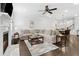 Living room boasts a fireplace, neutral decor, and seamless flow into the dining area at 871 Dunning St, Marietta, GA 30060