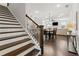 View of the open floor plan featuring the stairs, dining area and living room with fireplace at 871 Dunning St, Marietta, GA 30060