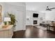 Bright living room featuring hardwood floors, a fireplace, ceiling fan, and neutral paint at 871 Dunning St, Marietta, GA 30060