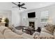 Comfortable living room with fireplace, ceiling fan, and hardwood floors for relaxation at 871 Dunning St, Marietta, GA 30060