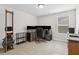 A well lit office space featuring multiple monitors, shelves, and a neutral carpet at 871 Dunning St, Marietta, GA 30060