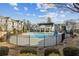 Community pool featuring a fenced-in pool area with an open clubhouse with seating at 871 Dunning St, Marietta, GA 30060