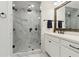 Modern bathroom featuring a walk-in shower with marble-look tile and a rainfall shower head at 871 Dunning St, Marietta, GA 30060