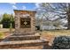 Entrance sign for North Square on a brick base with steps, greenery and trees in background at 871 Dunning St, Marietta, GA 30060