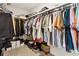 Walk-in closet with ample hanging space, shelving, and storage boxes for organization at 871 Dunning St, Marietta, GA 30060