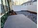Backyard features a new fence, gravel landscaping, and a concrete patio at 1510 Paramount Ln, Sugar Hill, GA 30518
