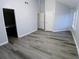 This bedroom has updated wood floors and neutral walls at 1510 Paramount Ln, Sugar Hill, GA 30518