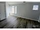 A spacious bedroom with multiple windows for lots of light at 1510 Paramount Ln, Sugar Hill, GA 30518