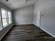 A bedroom has a vaulted ceiling and windows for lots of natural light at 1510 Paramount Ln, Sugar Hill, GA 30518
