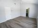 This bedroom features modern floors and access to the bathroom at 1510 Paramount Ln, Sugar Hill, GA 30518