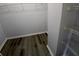 Walk-in closet has gray walls, LVP floors and wire shelving at 1510 Paramount Ln, Sugar Hill, GA 30518