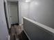 Hallway featuring wood-look floors and neutral walls at 1510 Paramount Ln, Sugar Hill, GA 30518