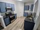 Well-equipped kitchen featuring stainless steel appliances and ample cabinet space at 1510 Paramount Ln, Sugar Hill, GA 30518