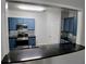 Modern kitchen with stainless steel appliances, granite countertops, and blue cabinets at 1510 Paramount Ln, Sugar Hill, GA 30518