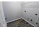 This laundry room features LVP flooring and washer/dryer hookups at 1510 Paramount Ln, Sugar Hill, GA 30518