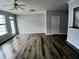 Bright, open living space with modern floors and a patio door for easy access at 1510 Paramount Ln, Sugar Hill, GA 30518