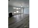Bright living room with a fireplace, ceiling fan, and natural light from several windows at 1510 Paramount Ln, Sugar Hill, GA 30518