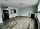 Spacious living area featuring a fireplace, modern flooring, and an open layout at 1510 Paramount Ln, Sugar Hill, GA 30518